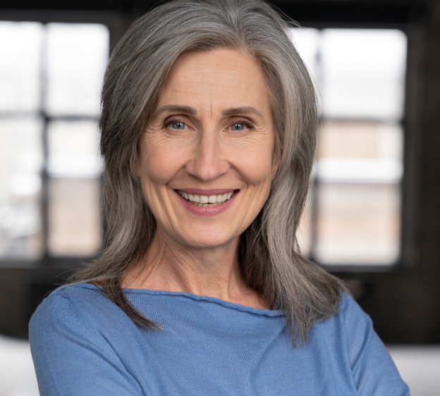 Adult woman smiling and facing forward