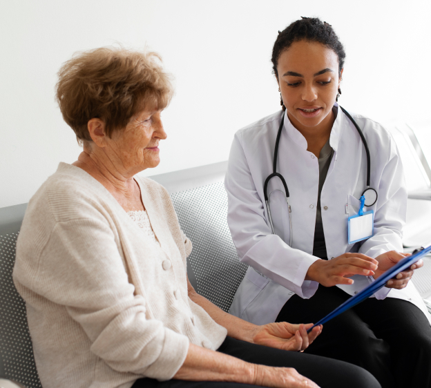 Older adult patient speaking with a medical provider sitting down together