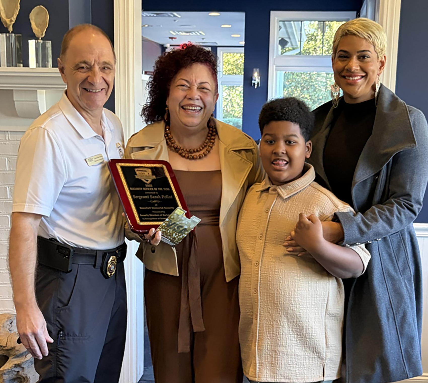 Jim Albano poses for a photo with Beaufort Memorial security's Sergeant Sarah Pellot and her family.