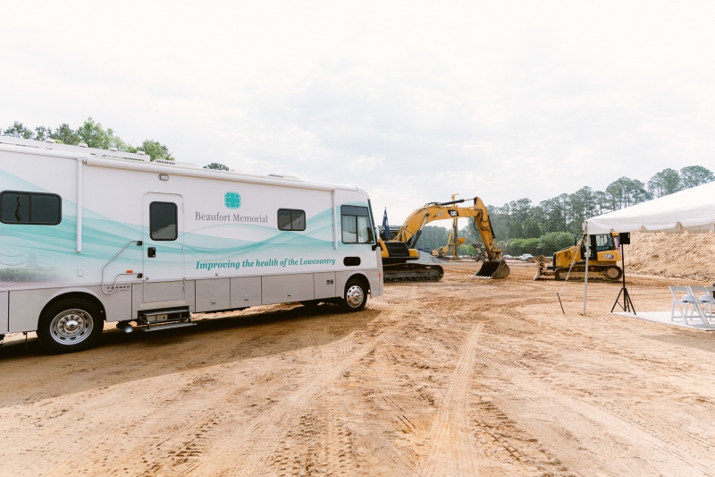 The Beaufort Memorial Mobile Wellness Unit in the foreground and construction machinery in the background