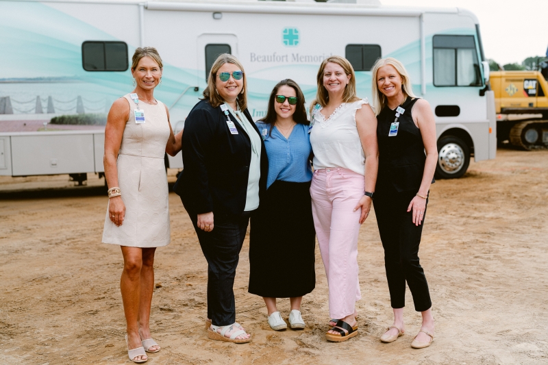 Beaufort Memorial staff members pose for a photo in front of the Mobile Wellness Unit