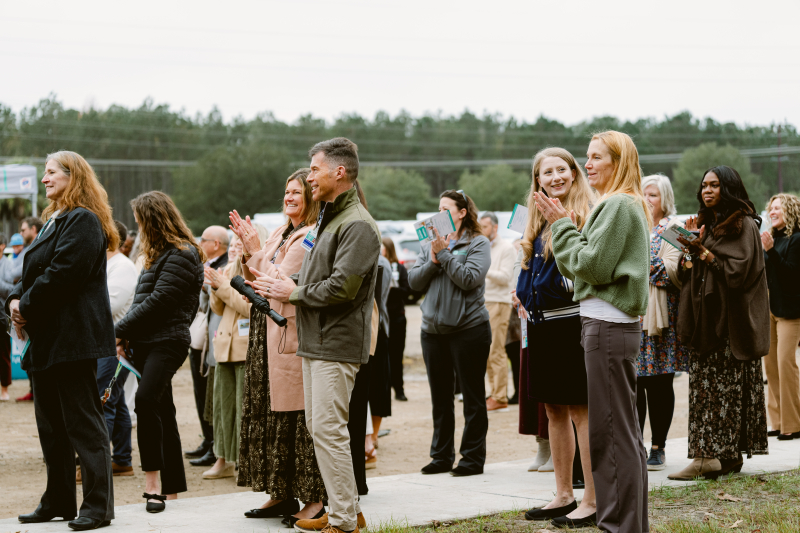 Beaufort Memorial employees applaude the placement of the final steel beam at the future Bluffton Community Hospital
