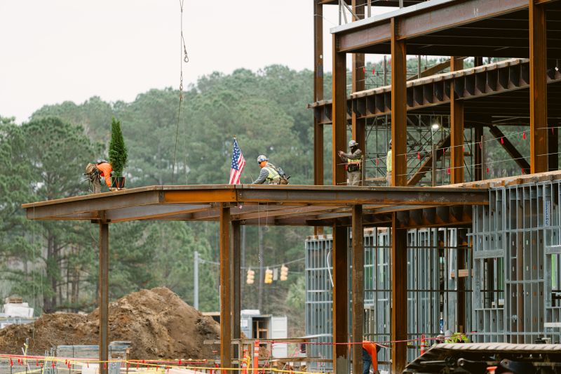 Construction crews place the final steel beam into place at the Beaufort Memorial Bluffton Community Hospital construction site.