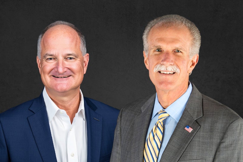 David Pearlman and Tony Britton headshots in front of a dark grey background.