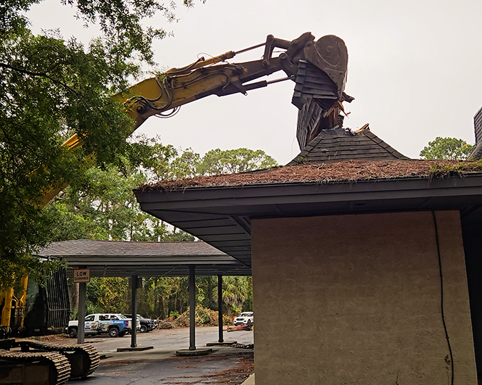 An excavator grabs roofing from the old Goodwill building located at 1016 William Hilton Parkway on Hilton Head Island, South Carolina.