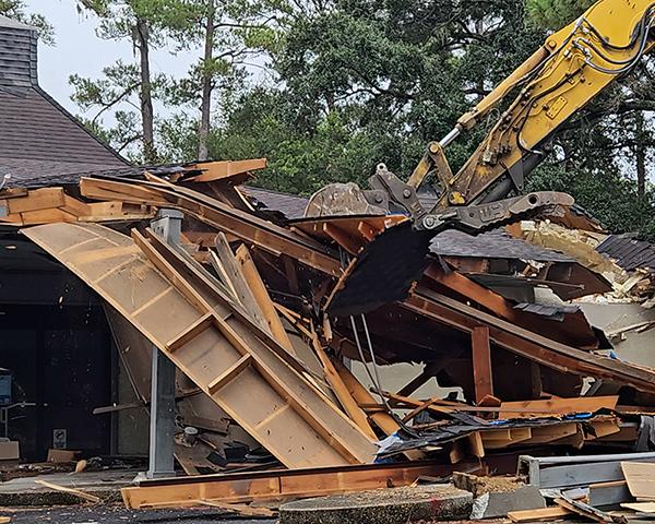 Demolition crews knock down the awning of the building at 1016 William Hilton Parkway that was the former home of Goodwill.