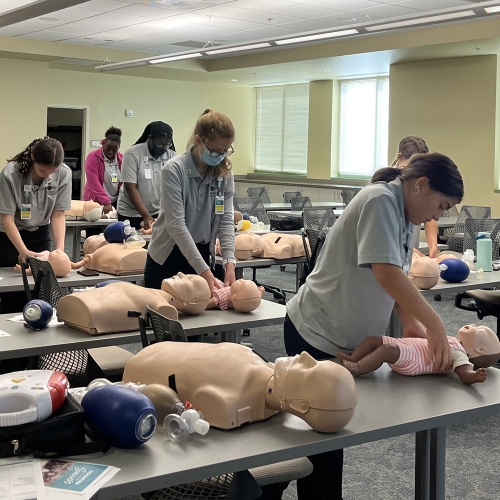 students learning basic life support