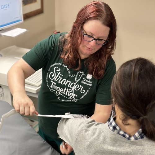 cardiopulmonary tech setting patient up for testing