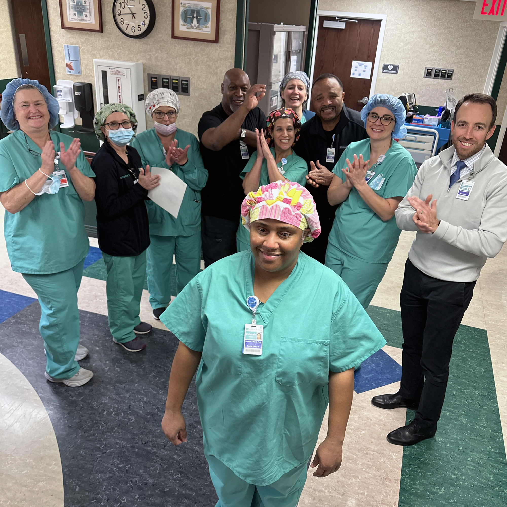 Beaufort Memorial staff members applaud a fellow employee for being recognized as a You Shine Through award recipient