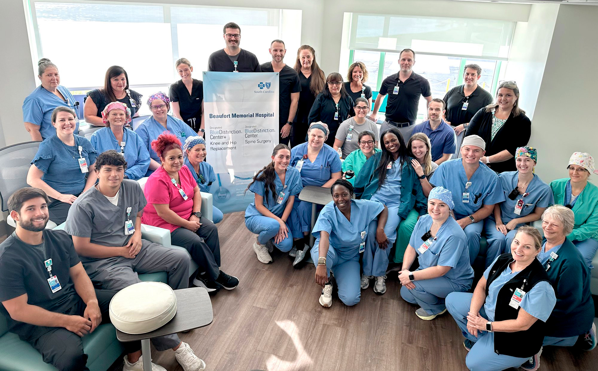 A large group of Beaufort Memorial staff members pose for a photo to celebrate receiving the Blue Cross Blue Shield of South Carolina Blue Distinction Center and Blue Distinction Center Plus awards