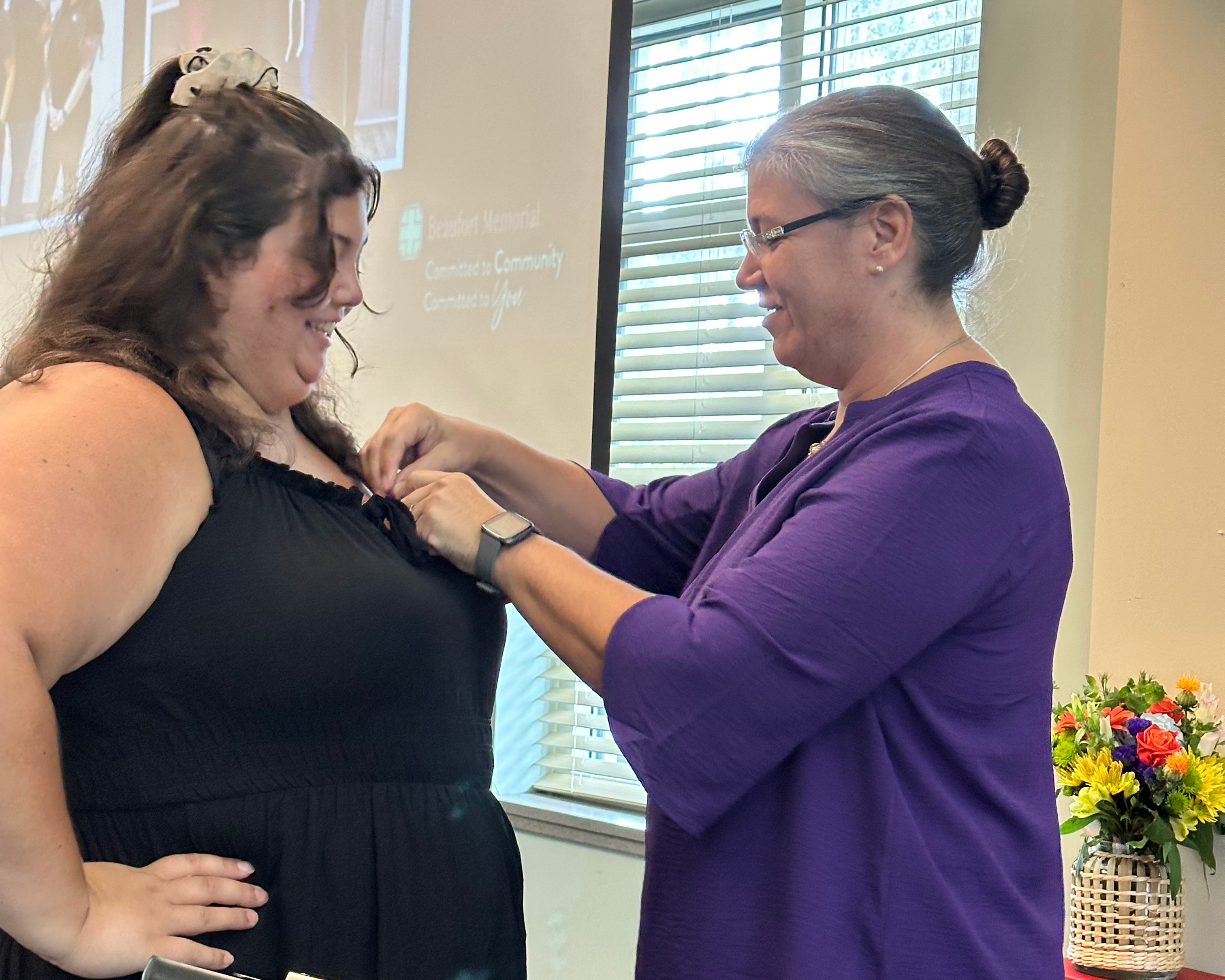 Arianna Morris gets pinned as a Certified Professional Coder (CPC)