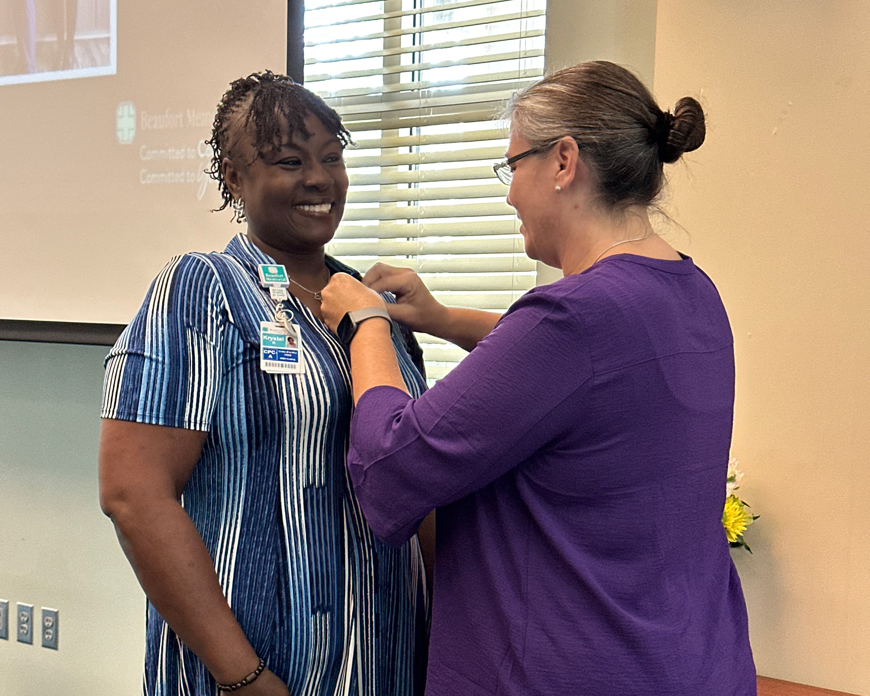 Krystal Brown gets pinned as a Certified Professional Coder (CPC)