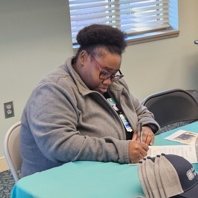 Shetara Rhodan signs a letter of intent for the Certified Medical Assistant pathway for cohort 12