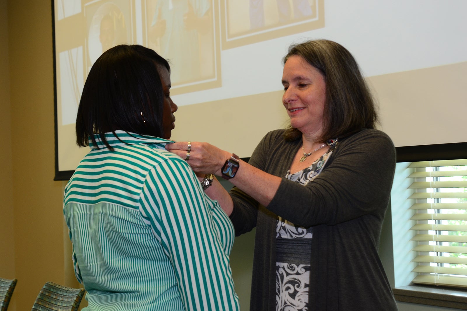 Tenisha Barker, TS-C receives her national certification pin from Mary Beth Smearman, RN.