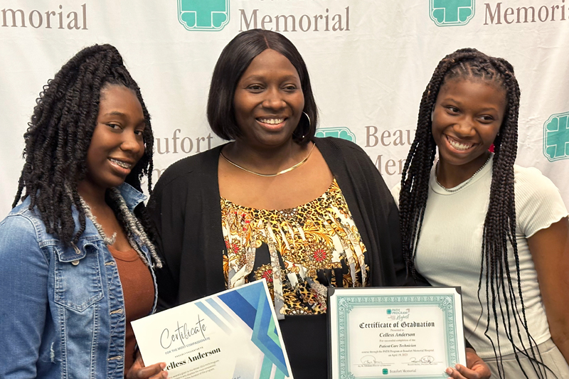 Celless Anderson and her two daughters at a PATH graduation