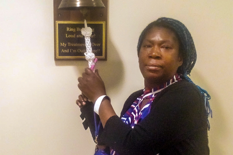 Lashana Greene rings the bell at the Keyserling Cancer Center after finishing her cancer treatment