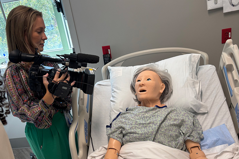 WSAV's Danielle Cobb films a simulation mannekin at Beaufort Memorial's PATH education center