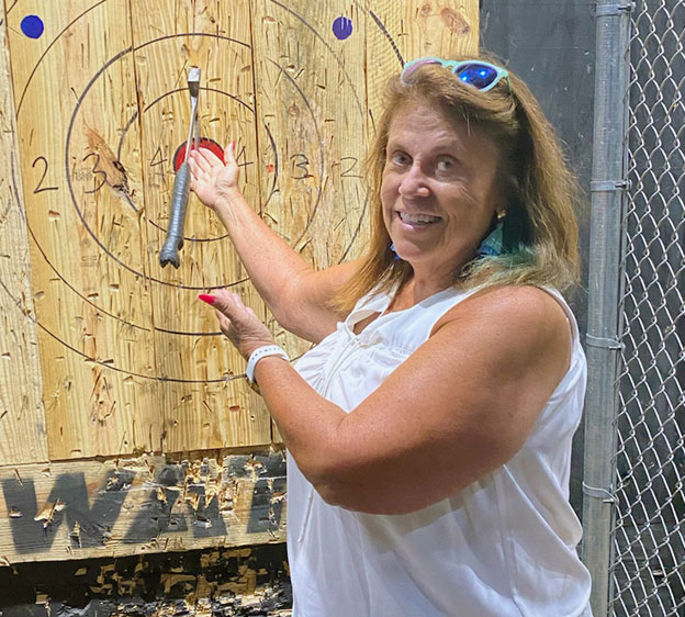 Brenda Blue, who received an ABUS ultrasound screening, at an axe-throwing facility