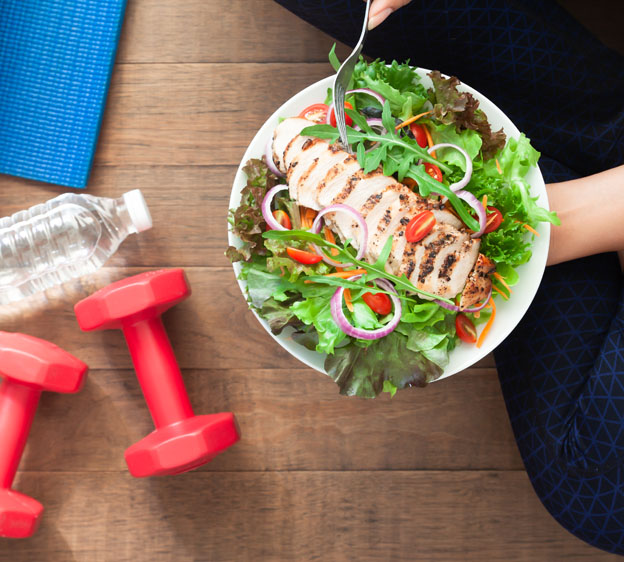 exercise equipment and a healthy salad