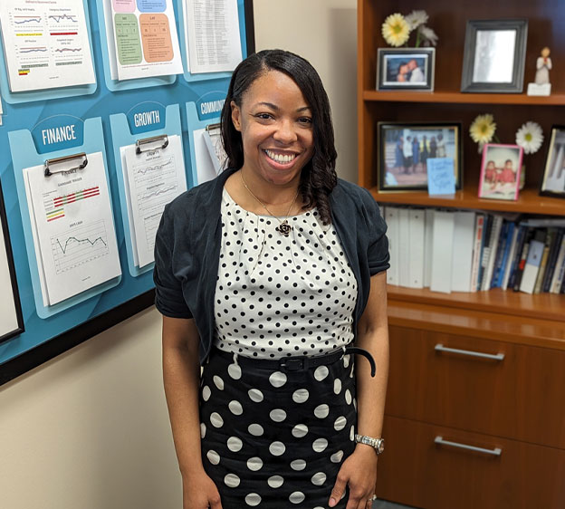 Joy Solomon, director of the Education Department and the PATH program at Beaufort Memorial, stands smiling at the camera.