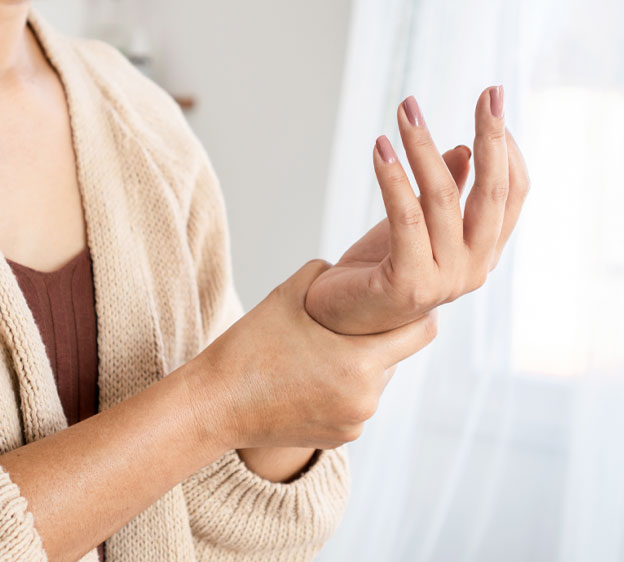 Woman holding her wrist in pain