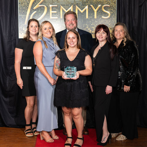 Members of the Emergency Department pose in front of Bemmys