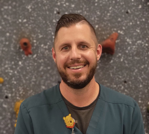 Jesse Ausec helps his patients reach functional goals through occupational therapy.