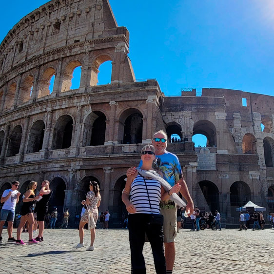 John Aust and his wife Kim in front of ancient ruins