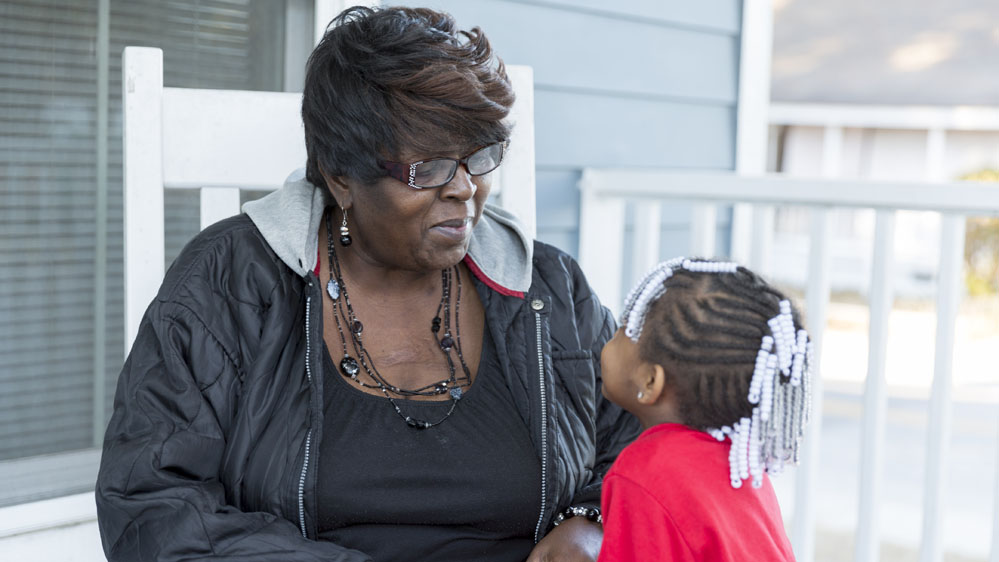 Sherline Holmes speaking to her grand-daughter