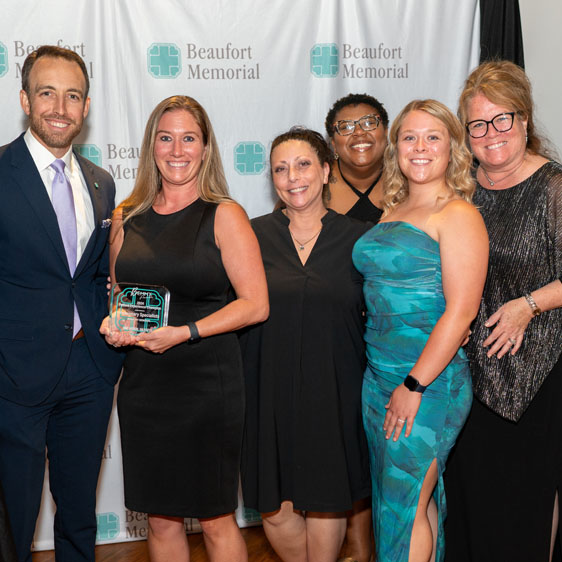The Pulmonary Specialists team poses after winning the Patient Experience Champions Award for outpatients.