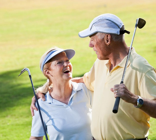 Husband and wife golfing