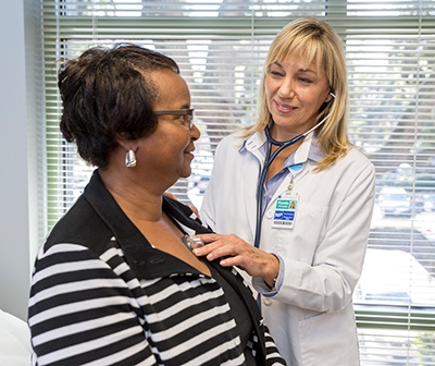 Ronda OConnell, an advanced practice provider a Beaufort Memorial Hospital, listens to a patient's heartbeat.