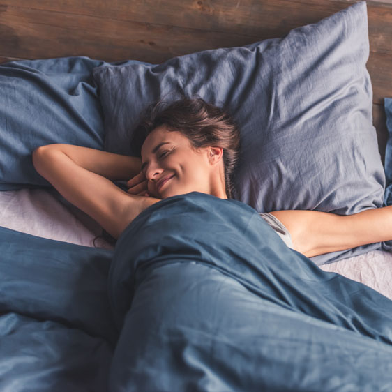 woman waking refreshed from a good night's sleep