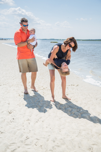 family walking along the beach