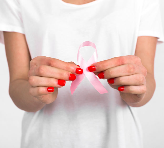 Woman holding a pink ribbon