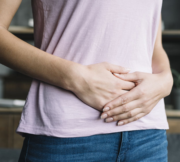 woman holding her tummy in pain