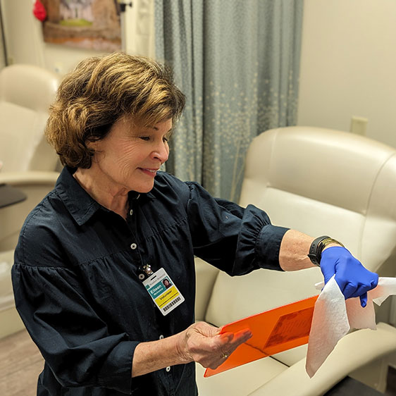 A Beaufort Memorial volunteer cleans a clipboard