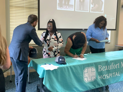 Employees sign letters of intent to take part in the PATH program's Cohort 10